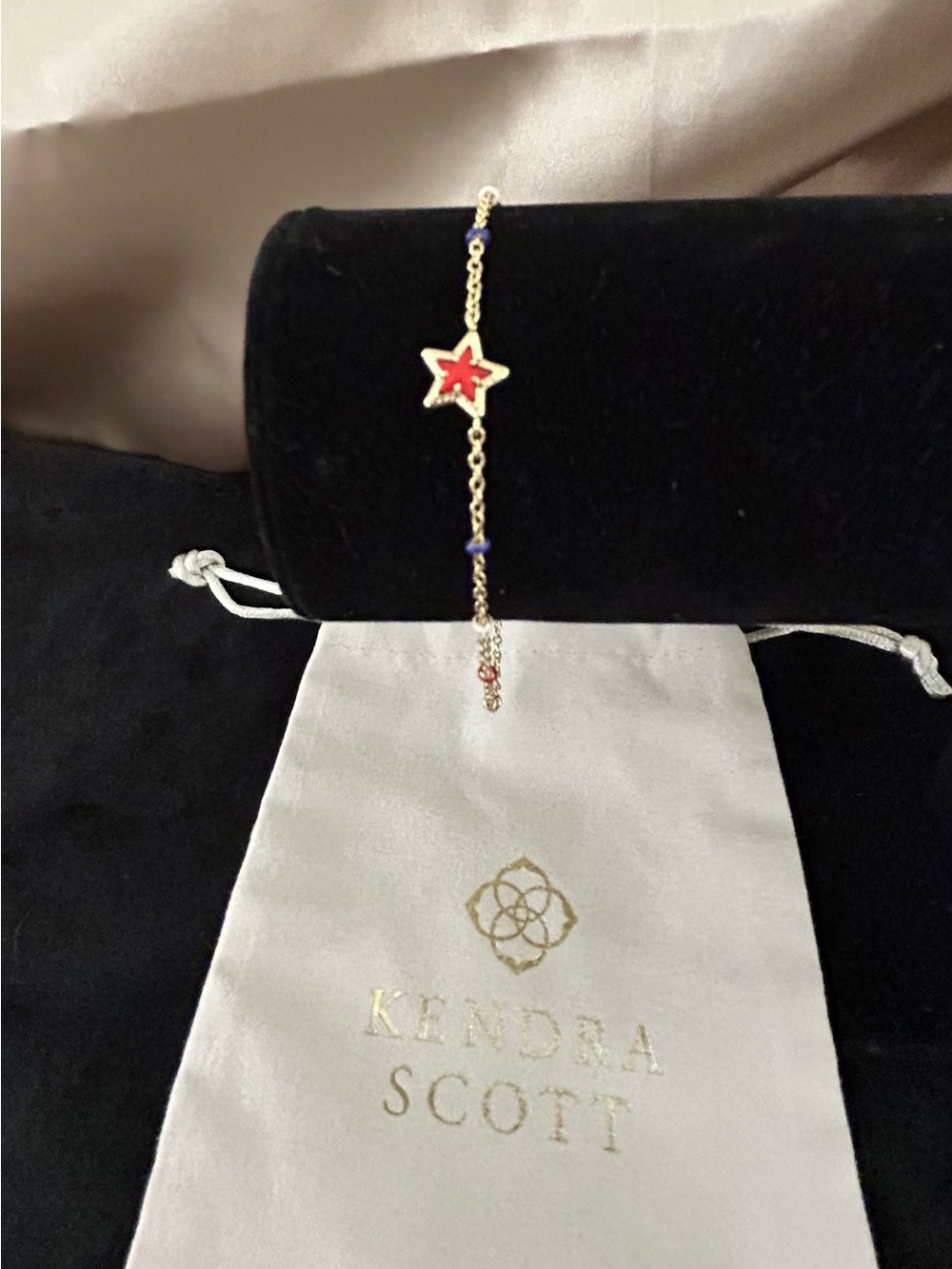Kendra Scott Gold Chain Bracelet with Red Star Charm and Blue Beads